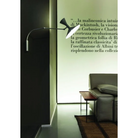 The Lampe de Marseille Mini Wall Sconce from Nemo in black in a family room.