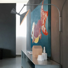 The Lampe de Marseille Mini Wall Sconce from Nemo in whitewash in a living room.