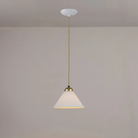 The small satin brass Cobb Pendant from Original BTC turned on.