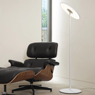 The white Circa Floor Lamp from Pablo Designs in a living room.