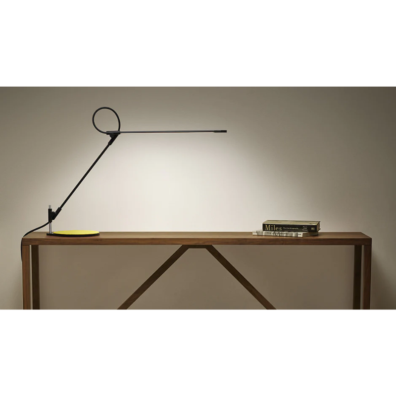 The black Superlight Table Lamp from Pablo Designs in a family area.