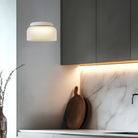 The Totem Mini Pendant from Pablo Designs in a living room. all-groups.