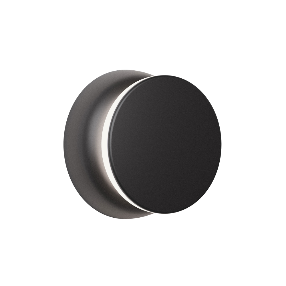 The black and black Totem Puck Ceiling or Wall Light from Pablo Designs.