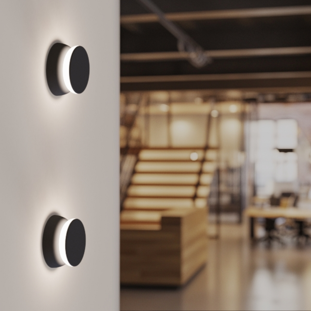 The Totem Puck Ceiling or Wall Light from Pablo Designs in a business office. all-groups