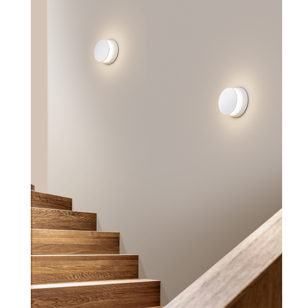 The Totem Puck Ceiling or Wall Light from Pablo Designs in a stairwell. all-groups