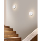 The Totem Puck Ceiling or Wall Light from Pablo Designs in a stairwell. all-groups