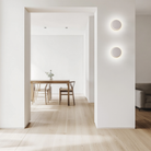 The Totem Puck Ceiling or Wall Light from Pablo Designs in a living room. all-groups