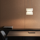The Totem Up/Down Mini Pendant from Pablo Designs in a meeting room. all-groups