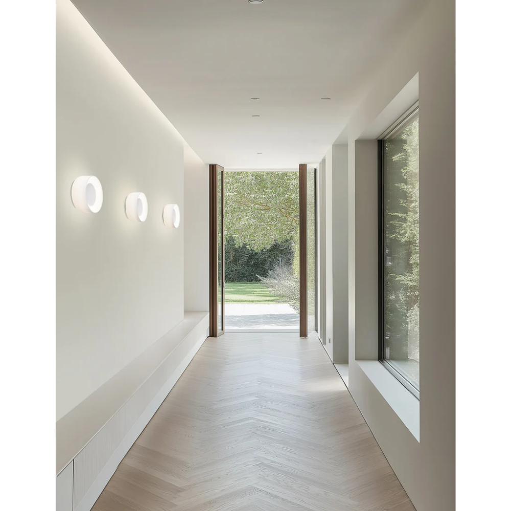 The Totem Sconce by Pablo Designs in White / White / White used in a living space. all-groups