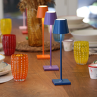The Poldina Pro Micro from Zafferano on a dining table with the color collection.