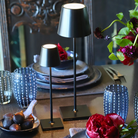 The black Poldina Pro Micro from Zafferano in a dining space.