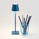 The capri blue Poldina Pro Micro from Zafferano in a home office.