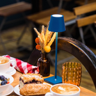 The capri blue Poldina Pro Micro from Zafferano on a dining table.