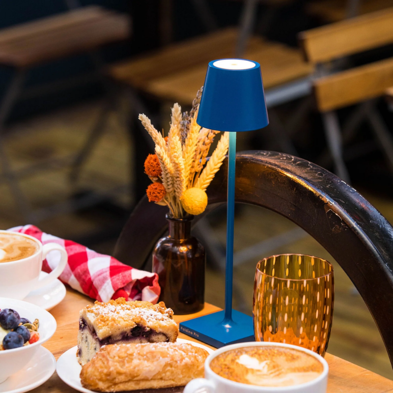 The capri blue Poldina Pro Micro from Zafferano on a dining table.