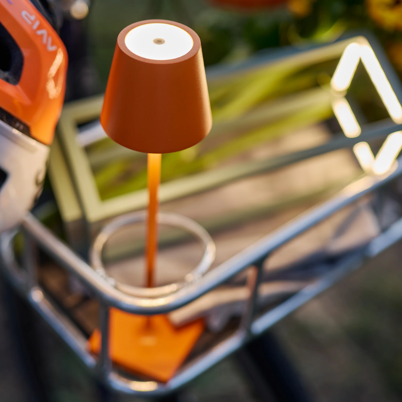 The orange Poldina Pro Micro from Zafferano in a living area.