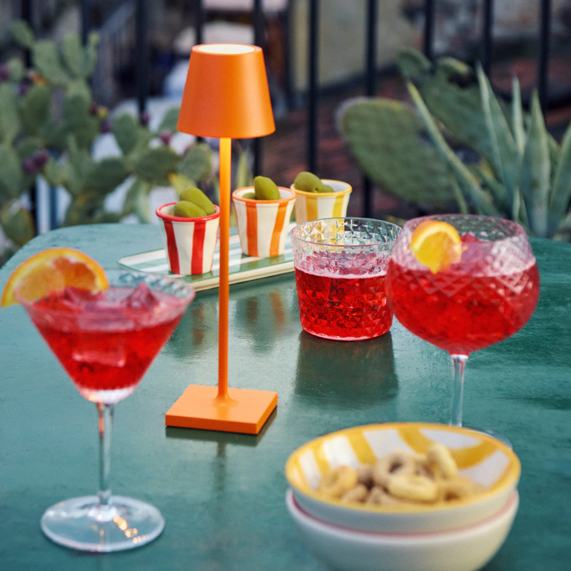 The orange Poldina Pro Micro from Zafferano in an outdoor space.