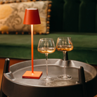 The red Poldina Pro Micro from Zafferano on an end table.