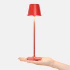 The red Poldina Pro Micro from Zafferano, a portable lamp.