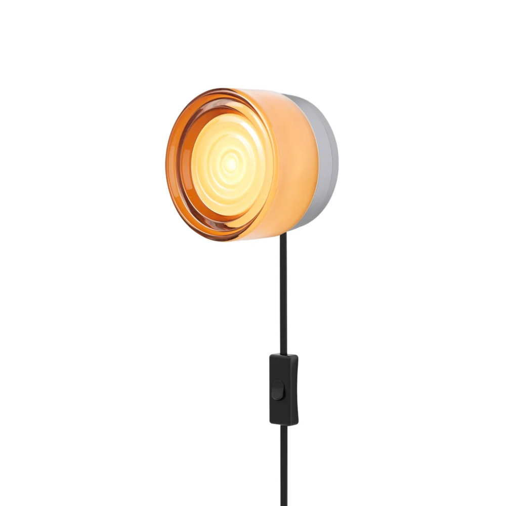 The Ripple Corded Sconce with plug-in bottom with toggle switch in copper exterior shade with natural anodized.