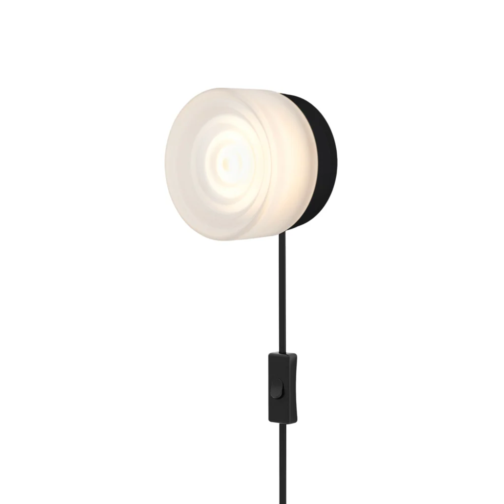 The Ripple Corded Sconce with plug-in bottom with toggle switch in frosted shade with black anodized.
