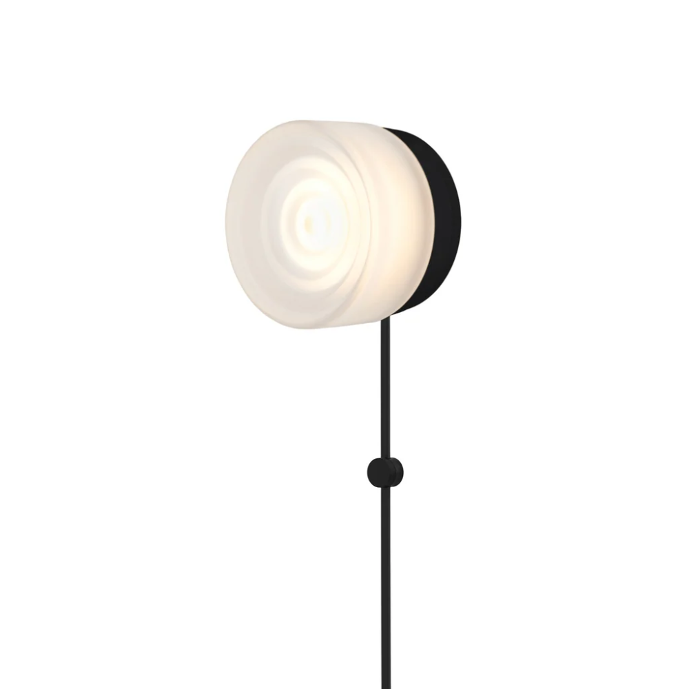 The Ripple Corded Sconce with plug-in bottom in frosted shade with black anodized.
