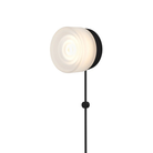 The Ripple Corded Sconce with plug-in bottom in frosted shade with black anodized.