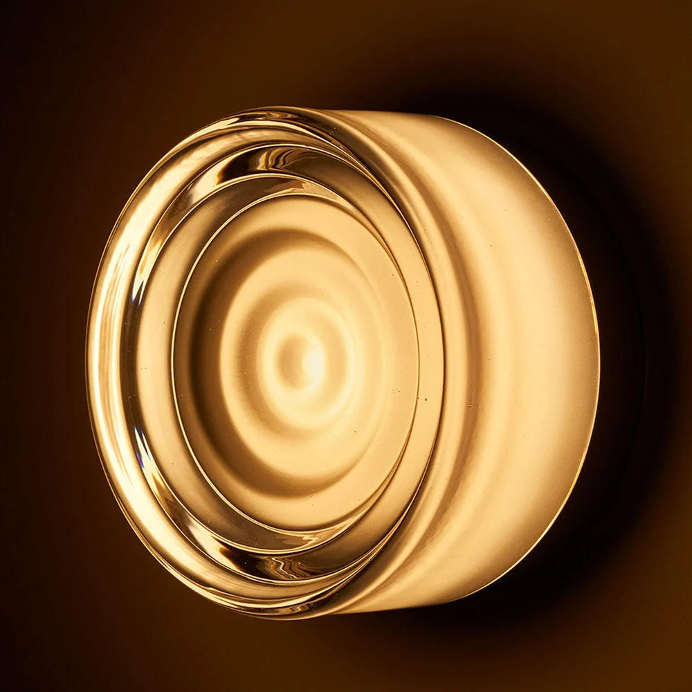 The Ripple Sconce by RBW in smoked with black anodized turned on. all-groups