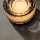 The Ripple Sconce by RBW in smoked with black anodized turned on. all-groups