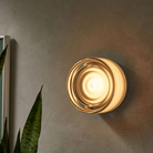 The Ripple Sconce by RBW in smoked with black anodized turned on. all-groups