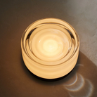 The Ripple Sconce by RBW in white interior with black anodized turned on. all-groups