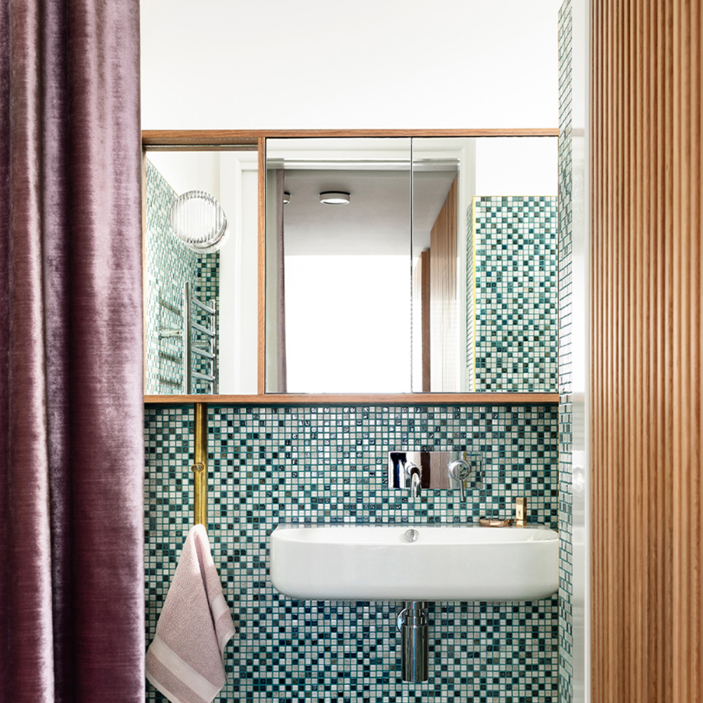 A Crisp Sconce by RBW installed on a vanity mirror. all-groups