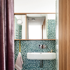 A Crisp Sconce by RBW installed on a vanity mirror. all-groups