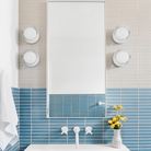 Two pairs of Crisp Sconces by RBW installed on either side of a mirror. all-groups