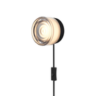 The Ripple Corded Sconce with plug-in bottom with toggle switch in smoke shade with black anodized.