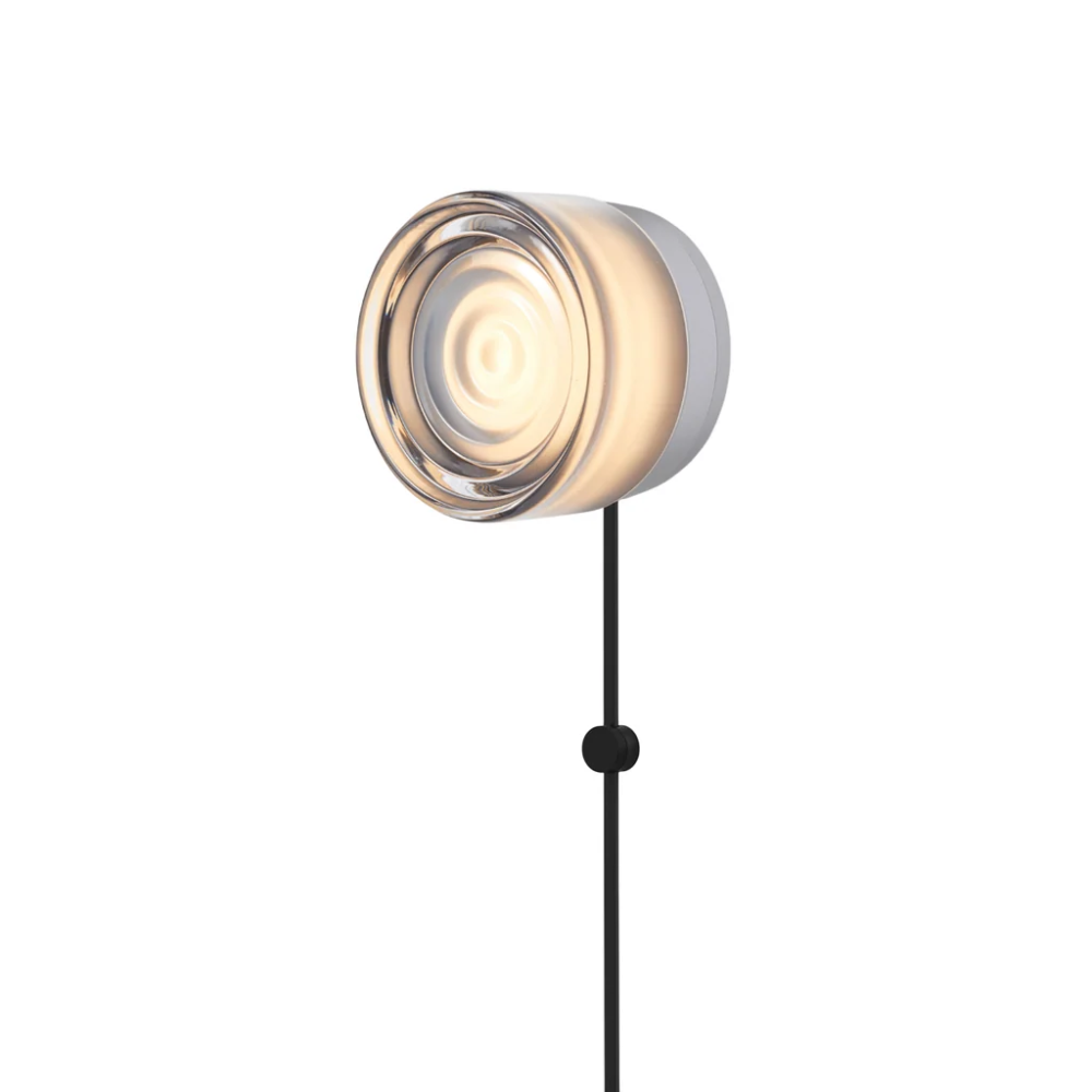 The Ripple Corded Sconce with plug-in bottom in smoke shade with natural anodized.
