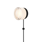 The Ripple Corded Sconce with plug-in bottom in white interior shade with black anodized.