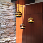 The Banded Amber Mini Pendant from Siemon and Salazar in a living room.