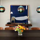 The Banded Aqua Mini Pendant from Siemon and Salazar in a dining room.