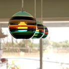 The Banded Aqua Mini Pendant from Siemon and Salazar in an office.
