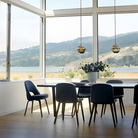 The Banded Stone Mini Pendant from Siemon and Salazar in a dining room.