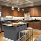The Barnacle Small Cone Clear Pendant from Siemon and Salazar in a kitchen.