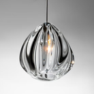 The Barnacle Small Cone Clear Pendant from Siemon and Salazar in a studio.