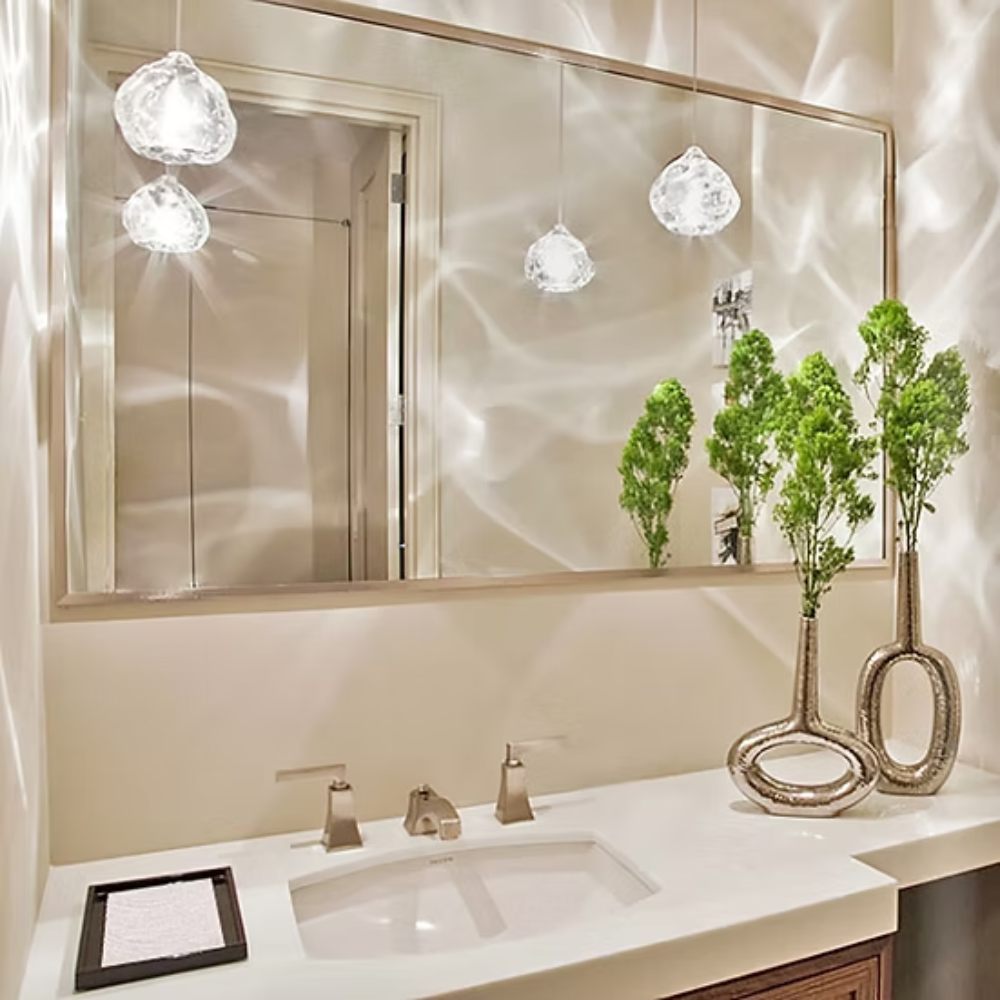 The clear Happy Small Pendant from Siemon and Salazar in a bathroom.