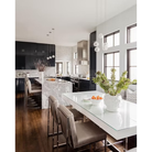 The clear Happy Small Pendant from Siemon and Salazar in a kitchen and dining area.