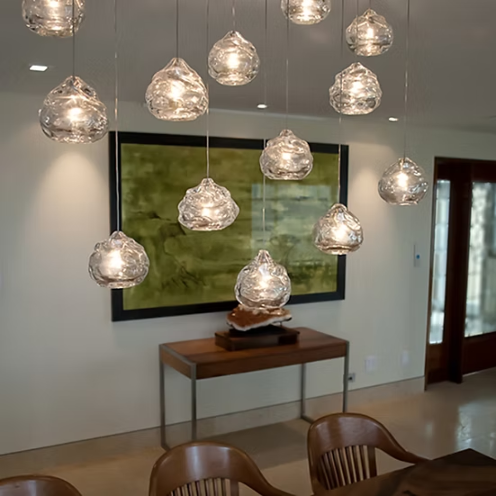 The clear Happy Small Pendant from Siemon and Salazar in a living room.
