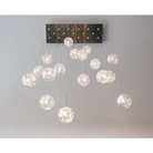 The clear Happy Small Pendant from Siemon and Salazar in a lounge.