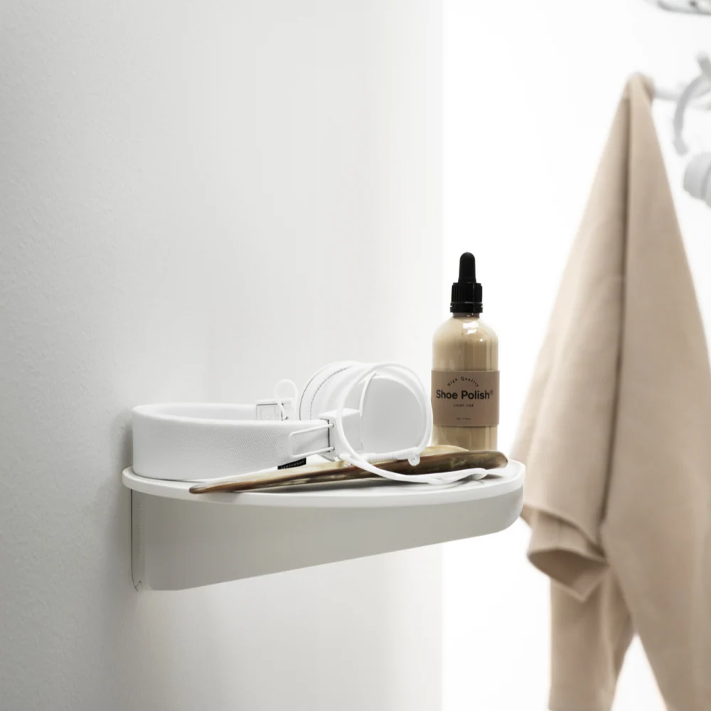 The Museum NM&.045 Console Shelf from String Furniture in white in a bathroom.