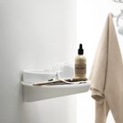 The Museum NM&.045 Console Shelf from String Furniture in white in a bathroom.