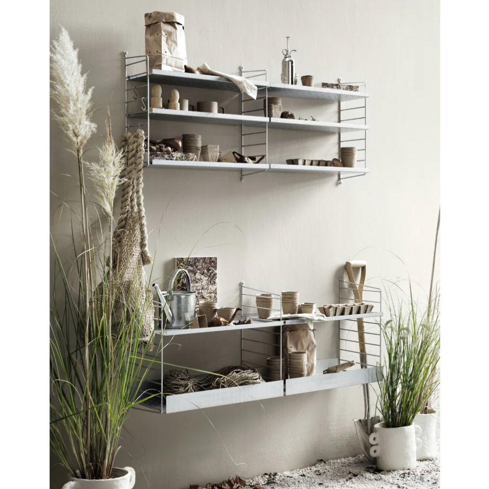 The Outdoor Bundle D from String Furniture being used in a garden.