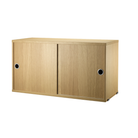 The Cabinet with Sliding Doors from String Furniture in the 11.8 inch depth size and oak color.